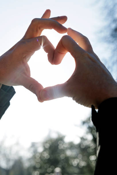 istock detail of man's hands making a heart 1300649438
