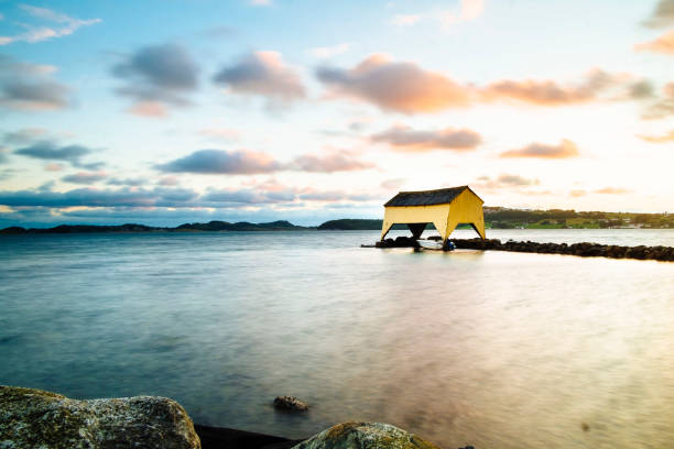 The famous yellow boathouse at Sola in the sunset