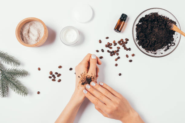istock Woman's hands apply homemade cosmetic coffee scrub 1300653998