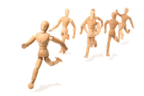 istock Wooden mannequin running to be the first - first in competition 1300655335