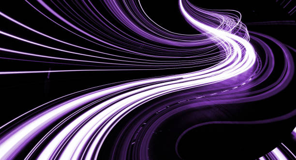 istock violet car lights at night. long exposure 1300655390