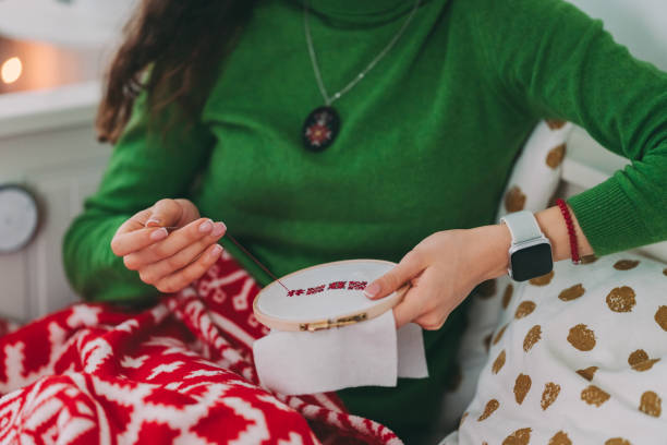 Cropped photo of woman doing hand embroidery