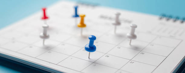 istock Calendar on solid blue background with copy space, pinned in a calender on datebusiness meeting schedule, travel planning or project milestone 1300657890