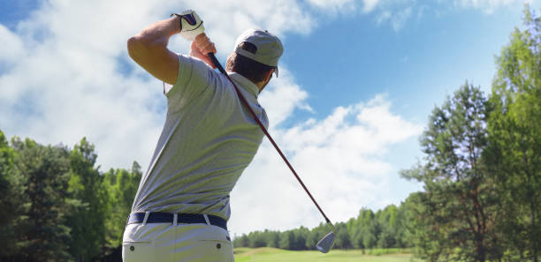 istock Golfer hitting golf shot with club on course while on summer vacation. 1300659028
