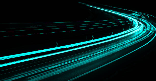 istock blue car lights at night. long exposure 1300660281