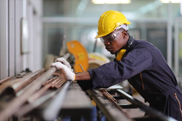 istock African American mechanic engineer worker is choosing copper tube for sawing while working in coolant factory with copy space 1300660377