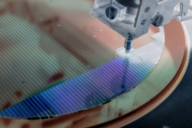 istock Pick up silicon die in silicon wafer in die attach machine in semiconductor manufacturing/negative color 1300661216