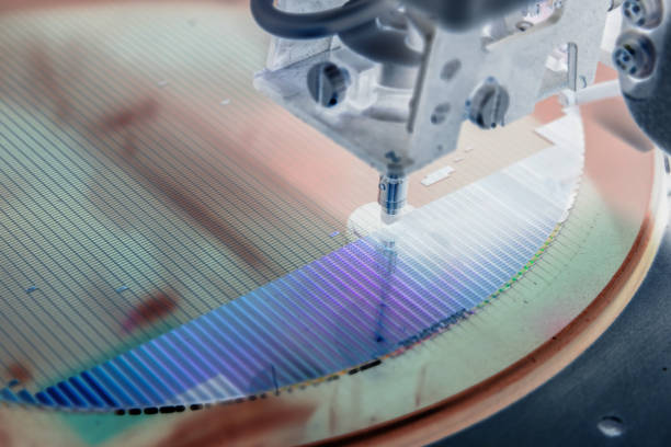 istock Pick up silicon die in silicon wafer in die attach machine in semiconductor manufacturing/negative color 1300661222
