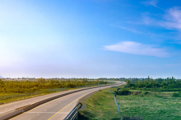 istock Road panorama on sunny spring day with lovely sky. 1300661450