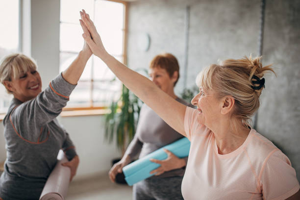 istock Senior women in yoga studio after training 1300662519