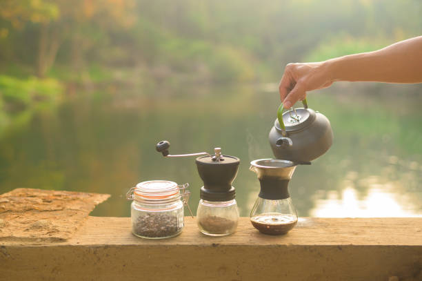 istock Close up coffee drip over nature background , relax travel concept. 1300664947