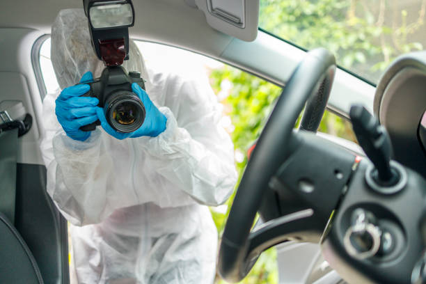 istock Forensic scientist taking photos of crime scene 1300665341