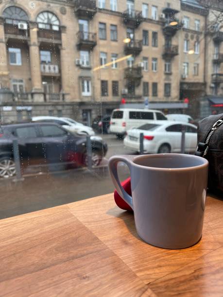 istock a cup on the windowsill and a view from the window 1300665535