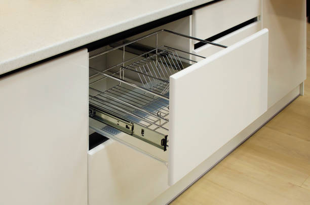 istock Modern kitchen, storage space for plates, drawer in luxury kitchen. 1300666446