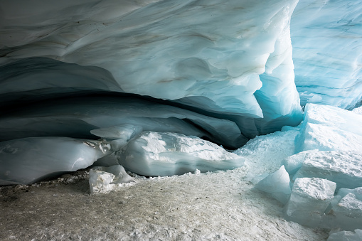 Ice cave in Whistler, Canada. Signs of client change. Nature background of a glacier.