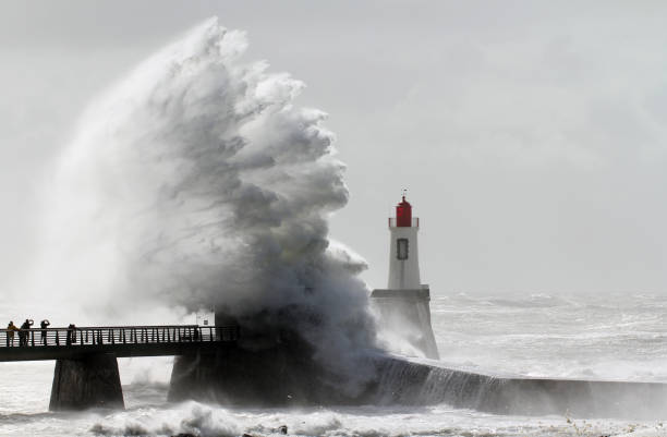 Big wave smash the jetty Big wave smash the jetty of la Chaume (Les Sables d'Olonne, France) groyne stock pictures, royalty-free photos & images