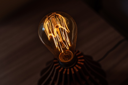 close-up of a lighted bulb in the dark