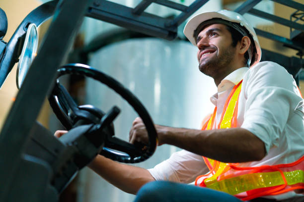 engineer staff male warehouse worker in hard hat working. walking through logistics center warehouse factory construction site logistics architect forklife driver man builder indoors background
