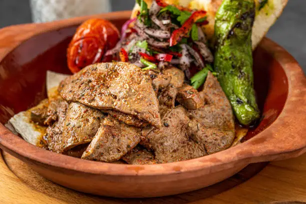 Traditional Turkish Liver kebab cuisine. Leaf Liver spicy. Delicious turkish ciger.