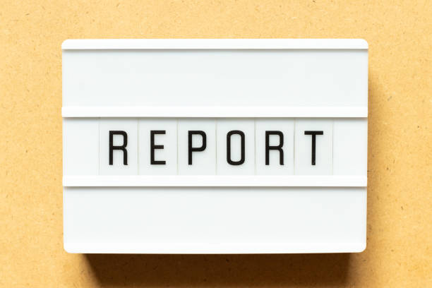 istock Lightbox with word report on wood background 1300672026