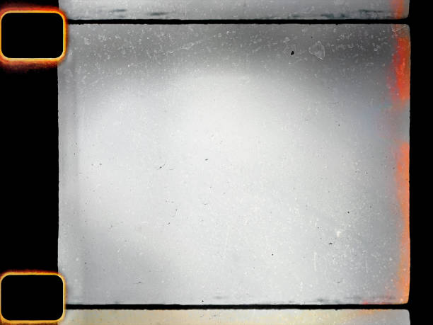 empty or blank 16mm film frame with black border and dust. stock photo