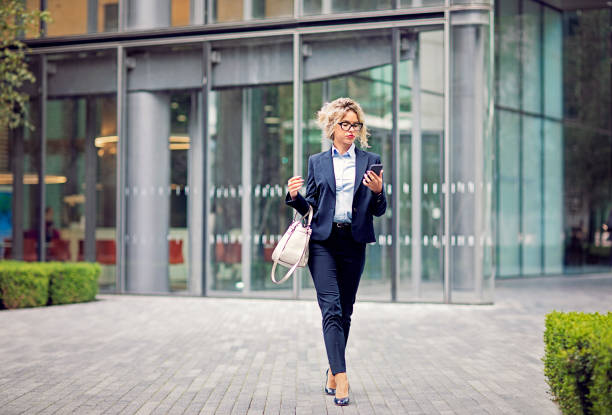 istock Young businesswoman is exiting from her office 1300677264