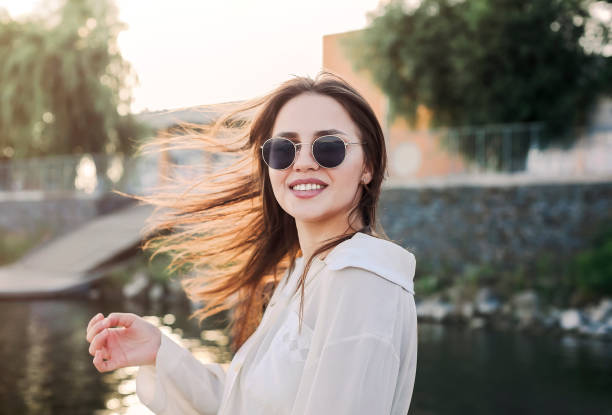 istock Charming woman in city during sunset 1300679886
