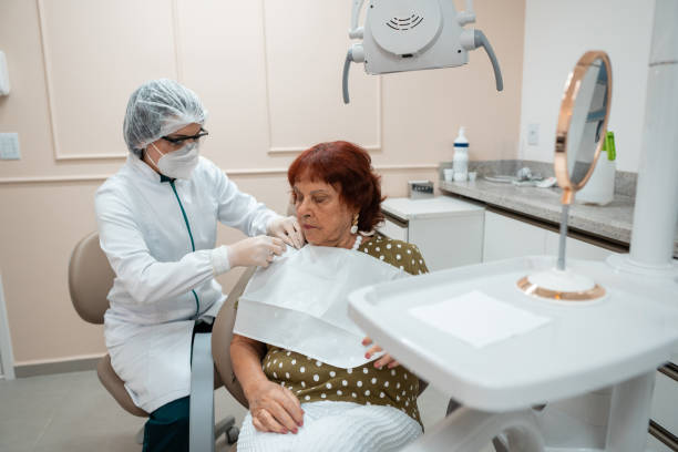 istock Dentist preparing the patient for the dental procedure 1300680743