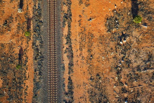 Rusty abandoned railroad tracks showing decay and overgrowth