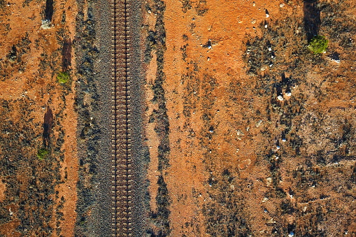 Rail across the flat desert plain