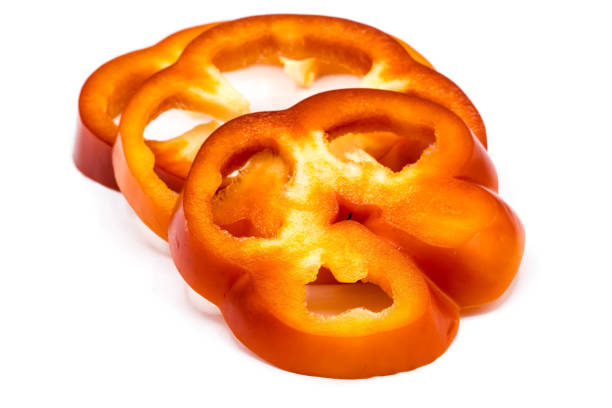 istock Bell pepper slices isolated on white background 1300683351