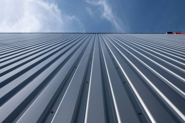 istock Corrugated iron sheet, aluminum Facade of a warehouse as background texture 1300684612