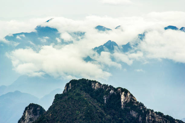 istock Clouds and mist around the mountains in Shennongjia, China 1300686189