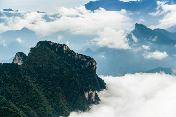 istock Clouds and mist around the mountains in Shennongjia, China 1300686246