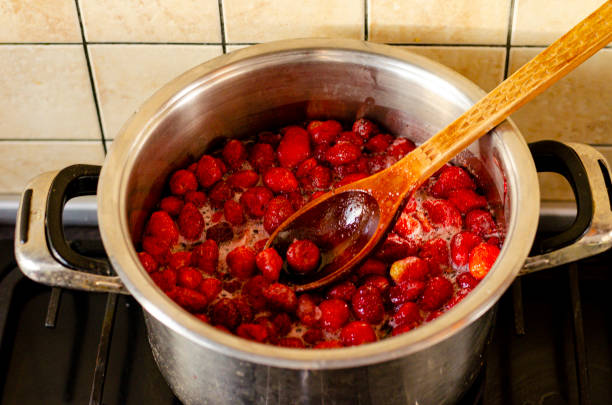 istock Strawberries are boiled with sugar in pan. 1300687599