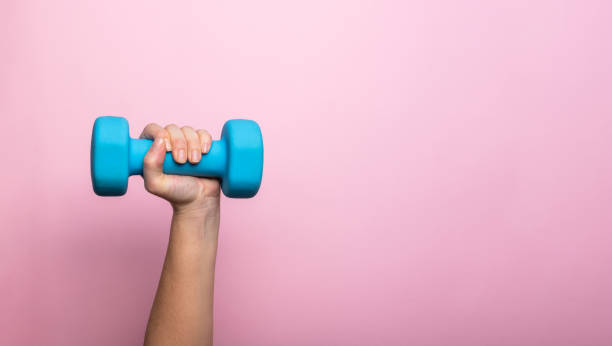 istock Fitness concept on pink backdrop 1300692770