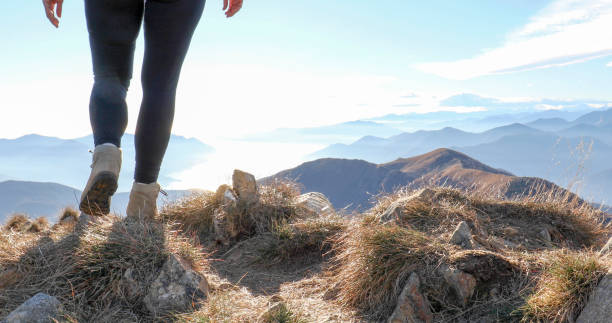 istock Low angle view of hiking legs on mountain ridge 1300696164