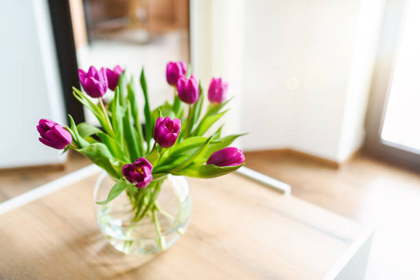 istock Beautiful pink tulips in a vase. 1300699831