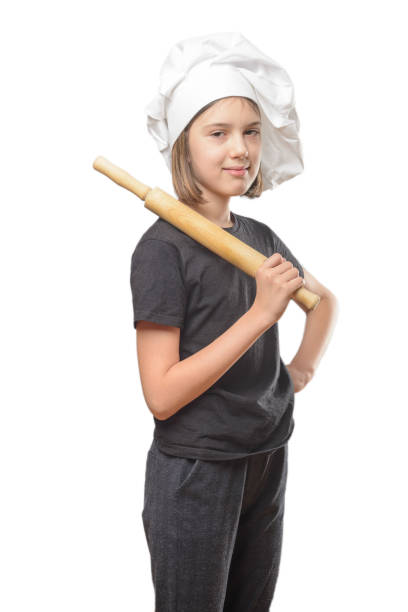 istock A young, female chef in a traditional hat and coat. 1300701060