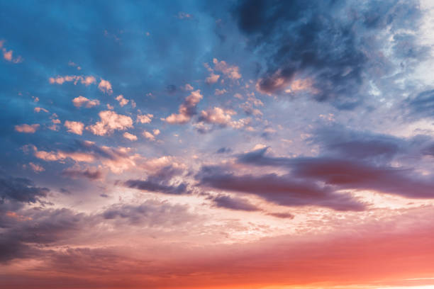 istock Colorful and peaceful sunset with red-tinted clouds. Sky Background or texture 1300701255