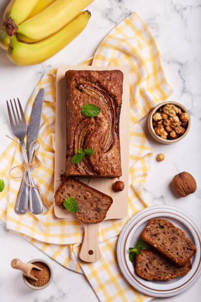 istock Banana bread with walnuts, hazelnuts and cinnamon. Top view 1300704273