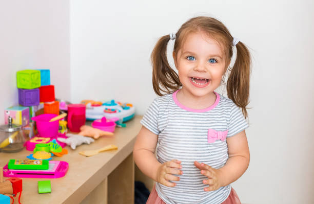 istock Delighted child laughing at home 1300704482