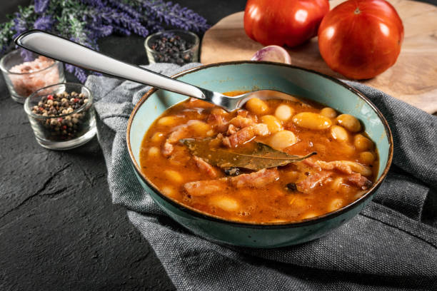 istock Beans with tomato sauce, bacon and sausage. 1300705856