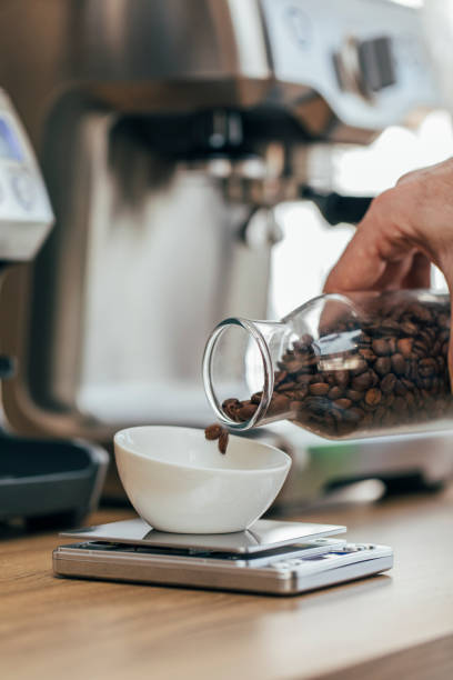 istock Barista Weighs Roasted Coffee Grains 1300707945
