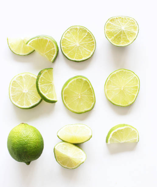 istock Lime. Fresh fruit isolated on white background. Slice, piece, half, quarter. Rich in nutrients, fiber, and vitamins. Picture design for food background. From top view. 1300708260