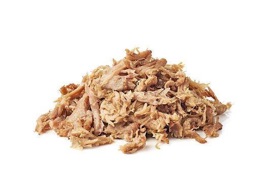 Heap of pulled pork isolated on white background. Clipping path included