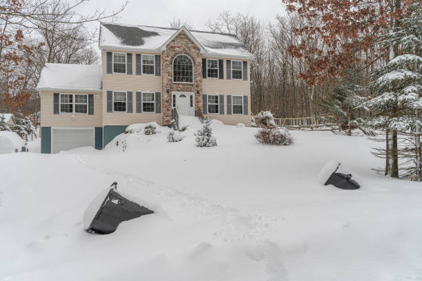 istock Aftermath. The residential house covered with the snow after heavy snowfall. 1300709820