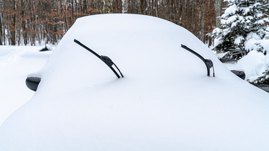 A car covered by snow after snowfall