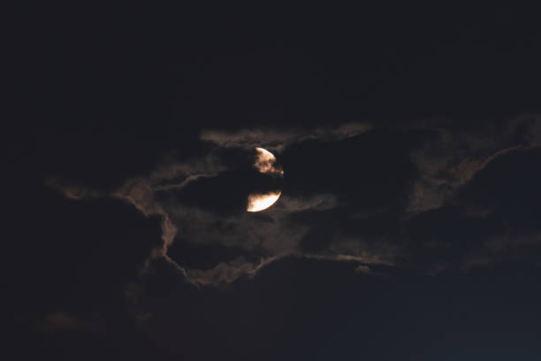 istock The moon among the stars and clouds 1300710981