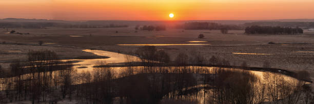 istock The panorama of sunrise on the river. 1300712169